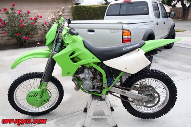 We found a used 2000 Kawasaki KDX 200 on Craigs List for less than $1000. It runs fine as is and has a green sticker, but we wanted to improve its ergonomics, fix its minor mechanical issues and refresh its appearance.