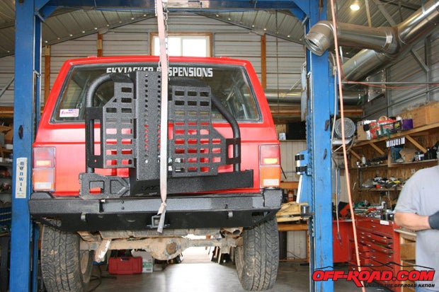 Install the tire gate onto the XRC bumper per the Smittybilt instructions, adjust the tire gate, and attach the bumper to the Cherokee. Make sure the bumper is aligned with the body properly and tighten all the mounting bolts at this time.