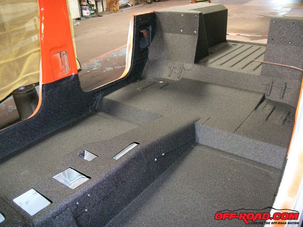 The floor was dropped four inches and Universal Bedliner employees are prepping the tub to be sprayed.