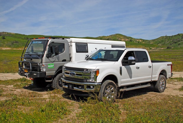 A comparison between the EarthCruiser EXP and a Ford F-250 pickup.