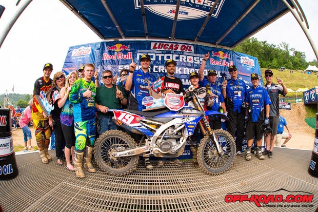 Jeremy Martin and family celebrate the win on the podium. 